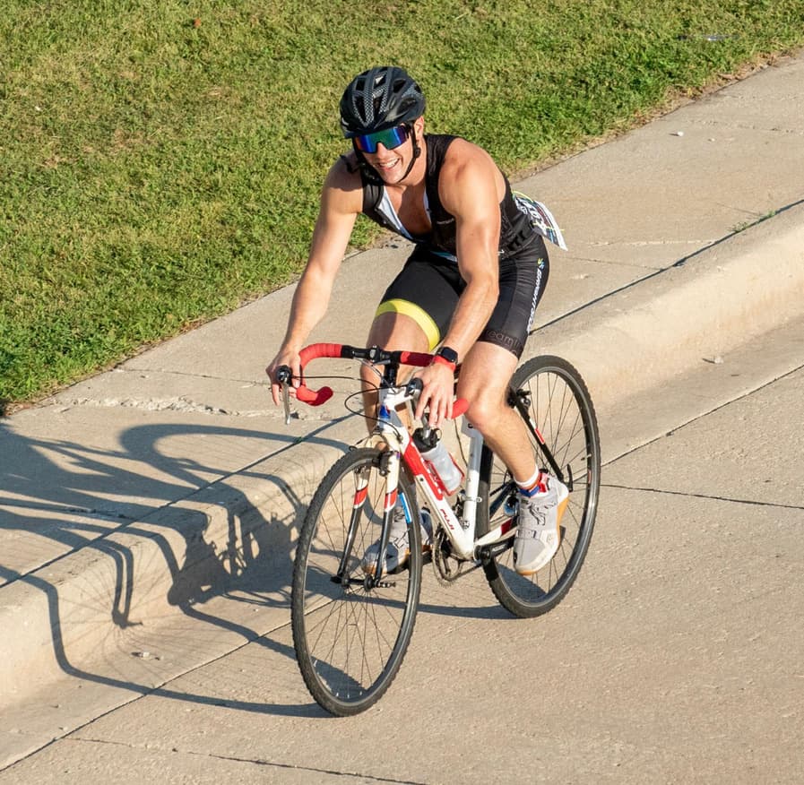 Smiling on the bike at Chicago Tri