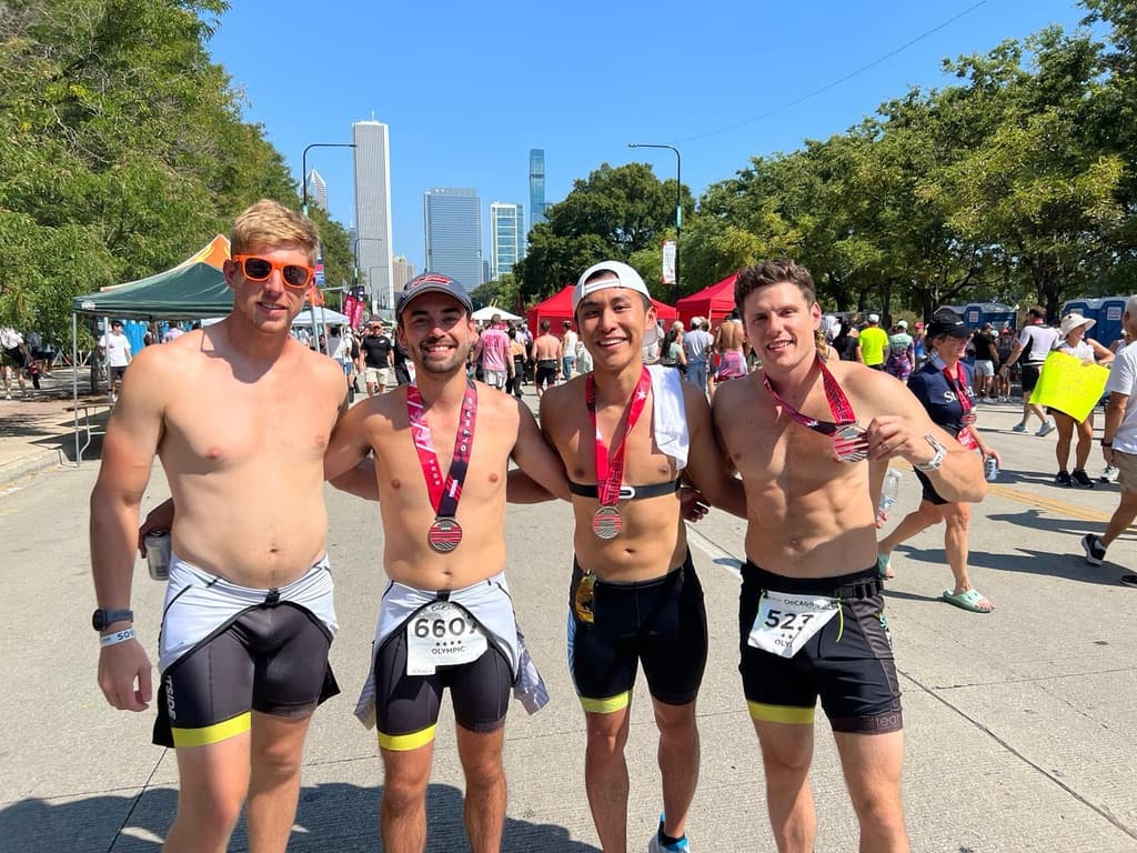 Friends with medals and Chicago skyline