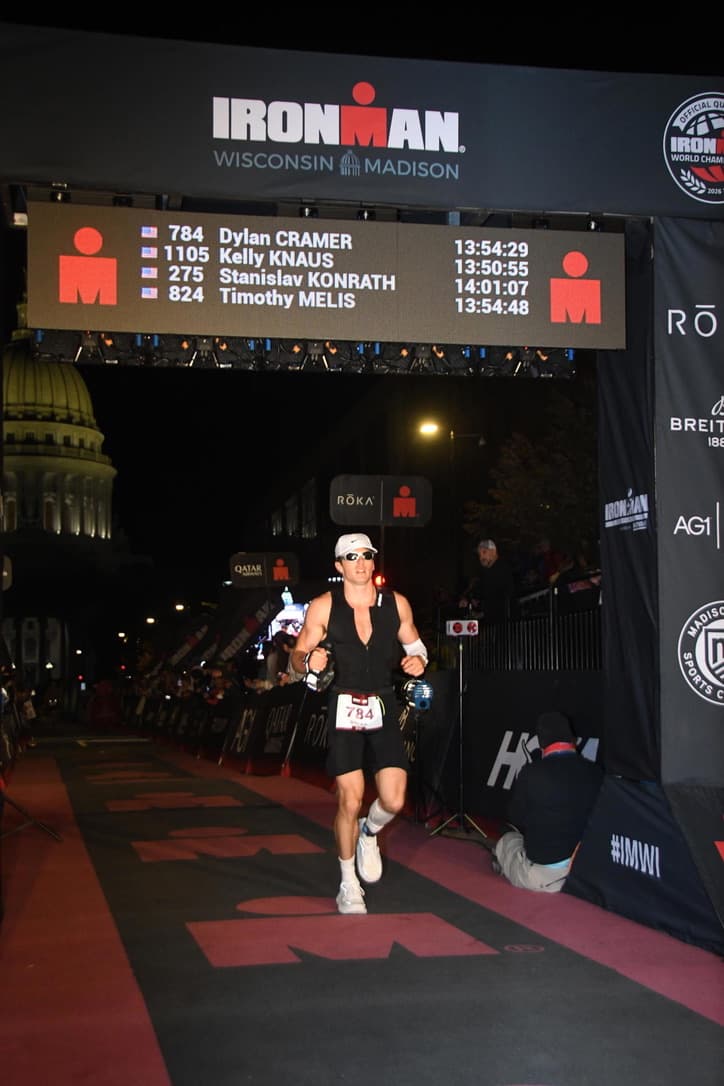 Dylan crossing the Ironman finish line
