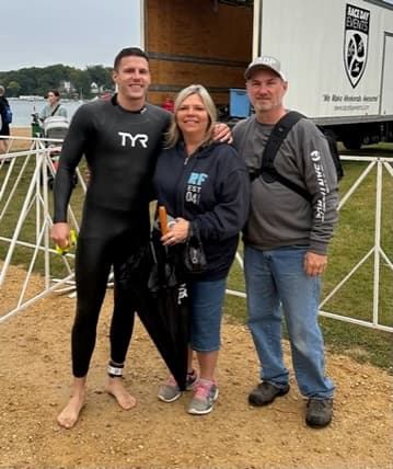 Family photo in wetsuit at Lake Geneva